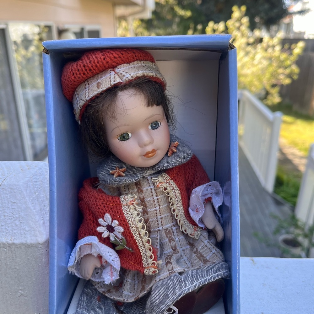 Cathay Collection Porcelain Doll with Red Hat